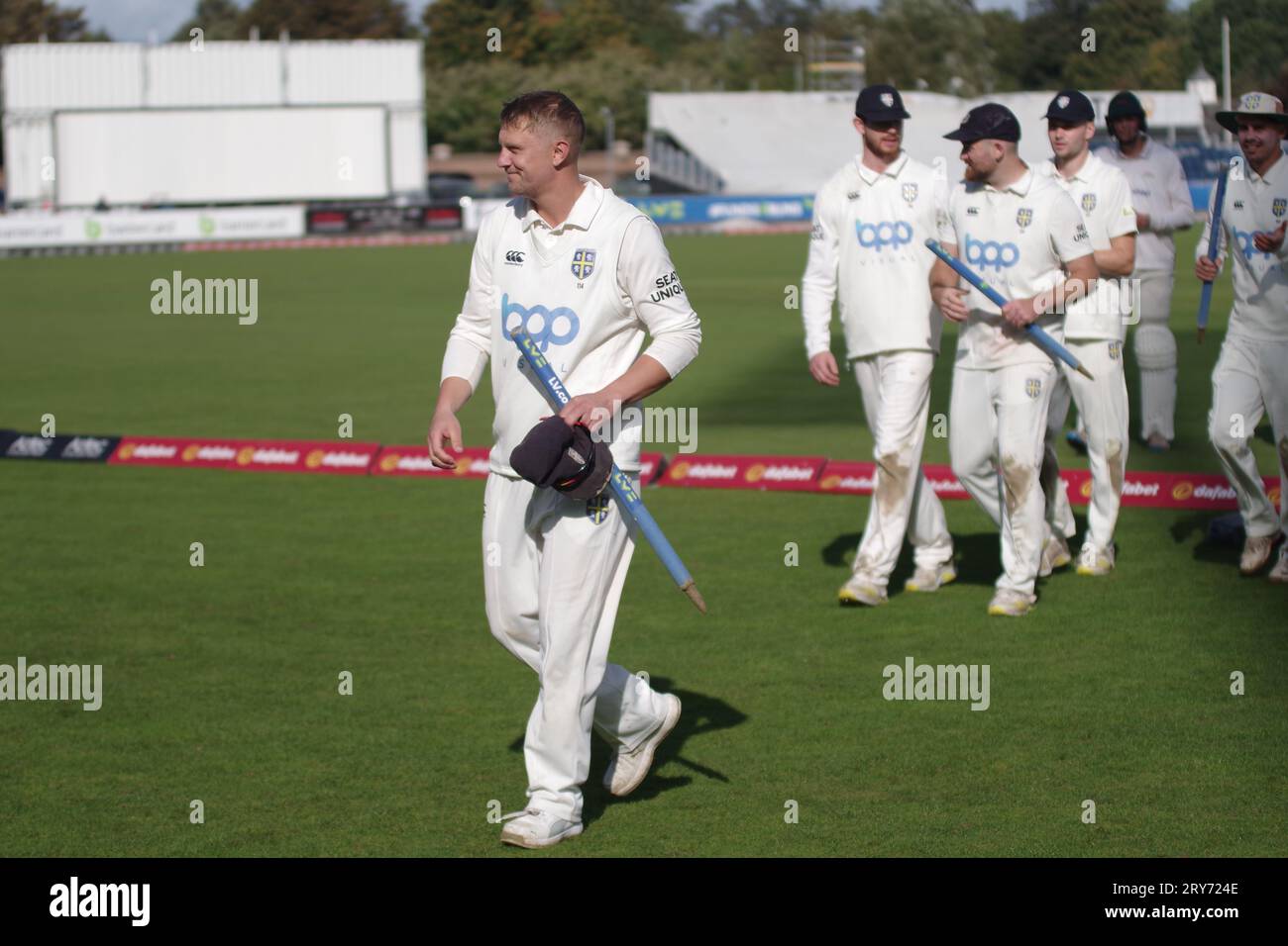 Chester le Street, 29 September 2023. Captain Scott Borthwick leading the Durham cricket team from the field after their win against Leicestershire in the County Championship Division 2 game at Seat Unique Riverside. Credit: Colin Edwards/Alamy Live News Stock Photo