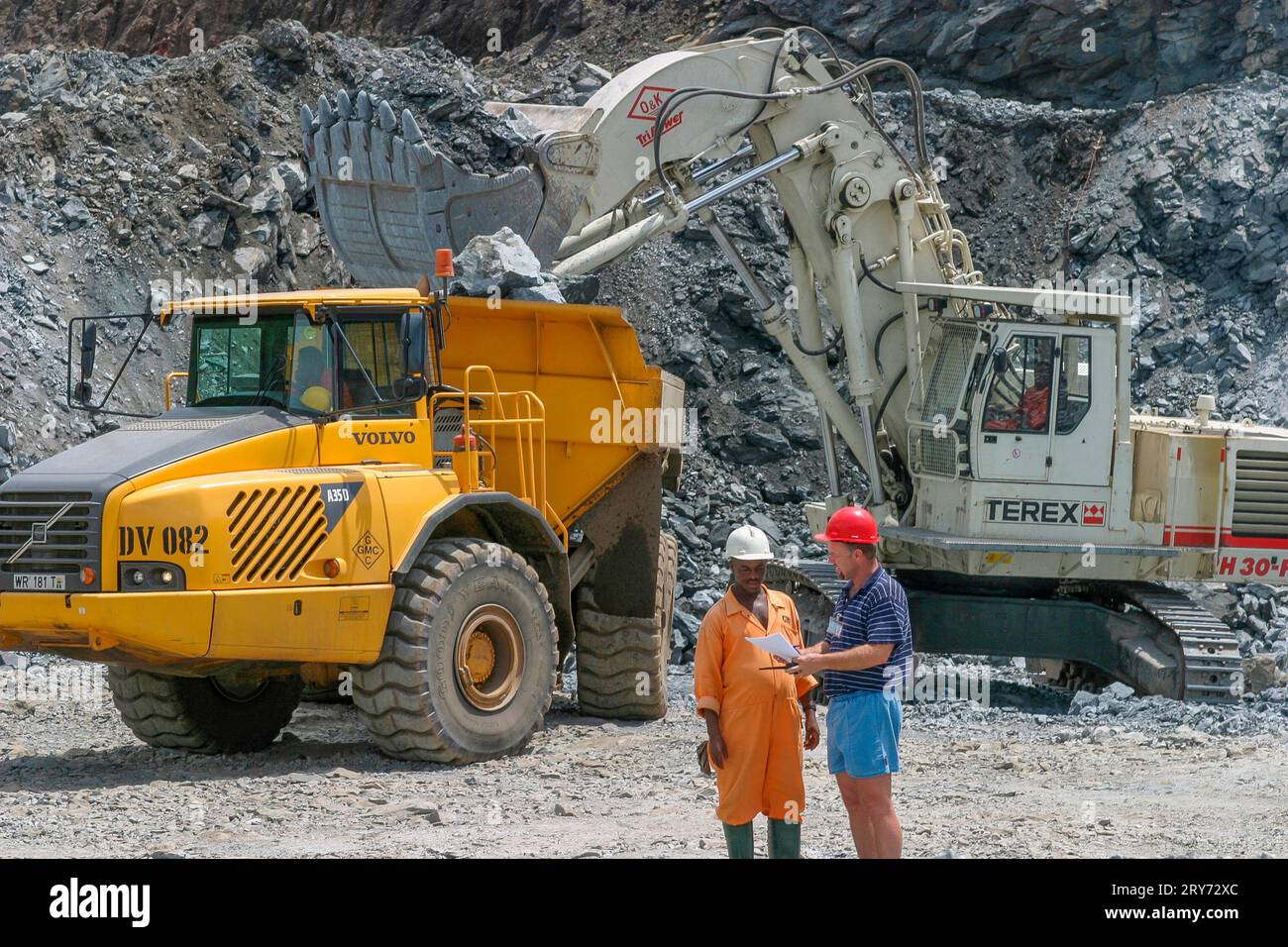 Ghana, Tarkwa. Overview of open pit with a manager of the mining