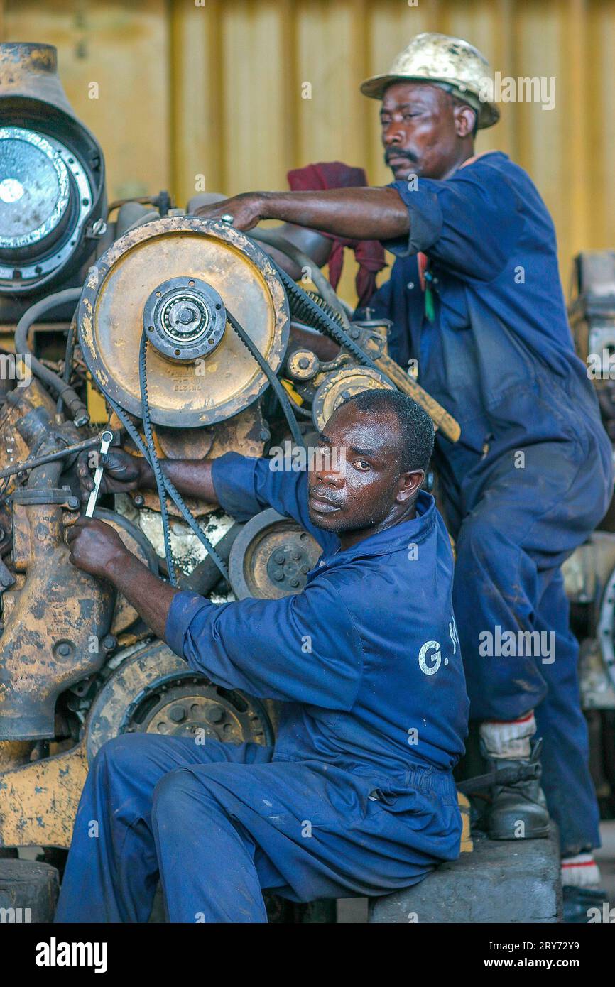 Ghana, Takoradi. Mechanics of Manganese mining company repair a motor