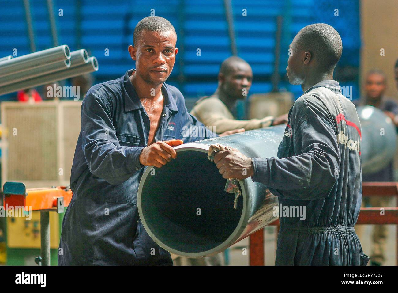 Ghana, Accra. Factory workers of Interplast Factory producing PVC pipes Stock Photo Alamy