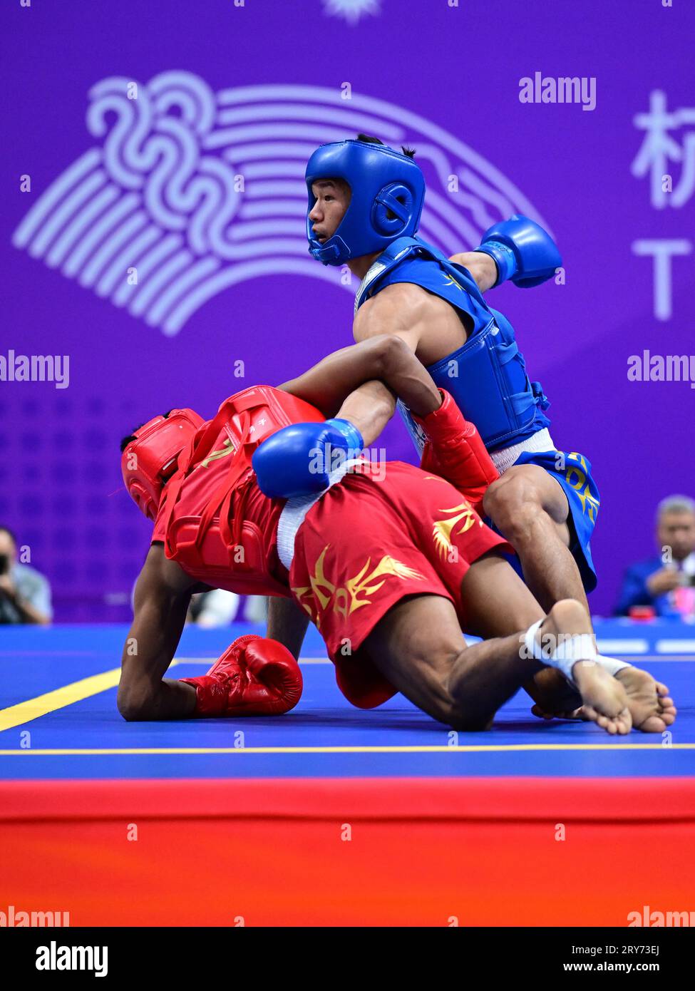 Hangzhou, China. 29th Sep, 2023. Arnel Mandal (L) of the Philippines and Jiang Haidong (R) of China compete during the Asian Games 2023, Wushu Sanda Men's 56Kg Final match at Xiaoshan Guali Sports Centre. Jiang won the match by point difference. Credit: SOPA Images Limited/Alamy Live News Stock Photo
