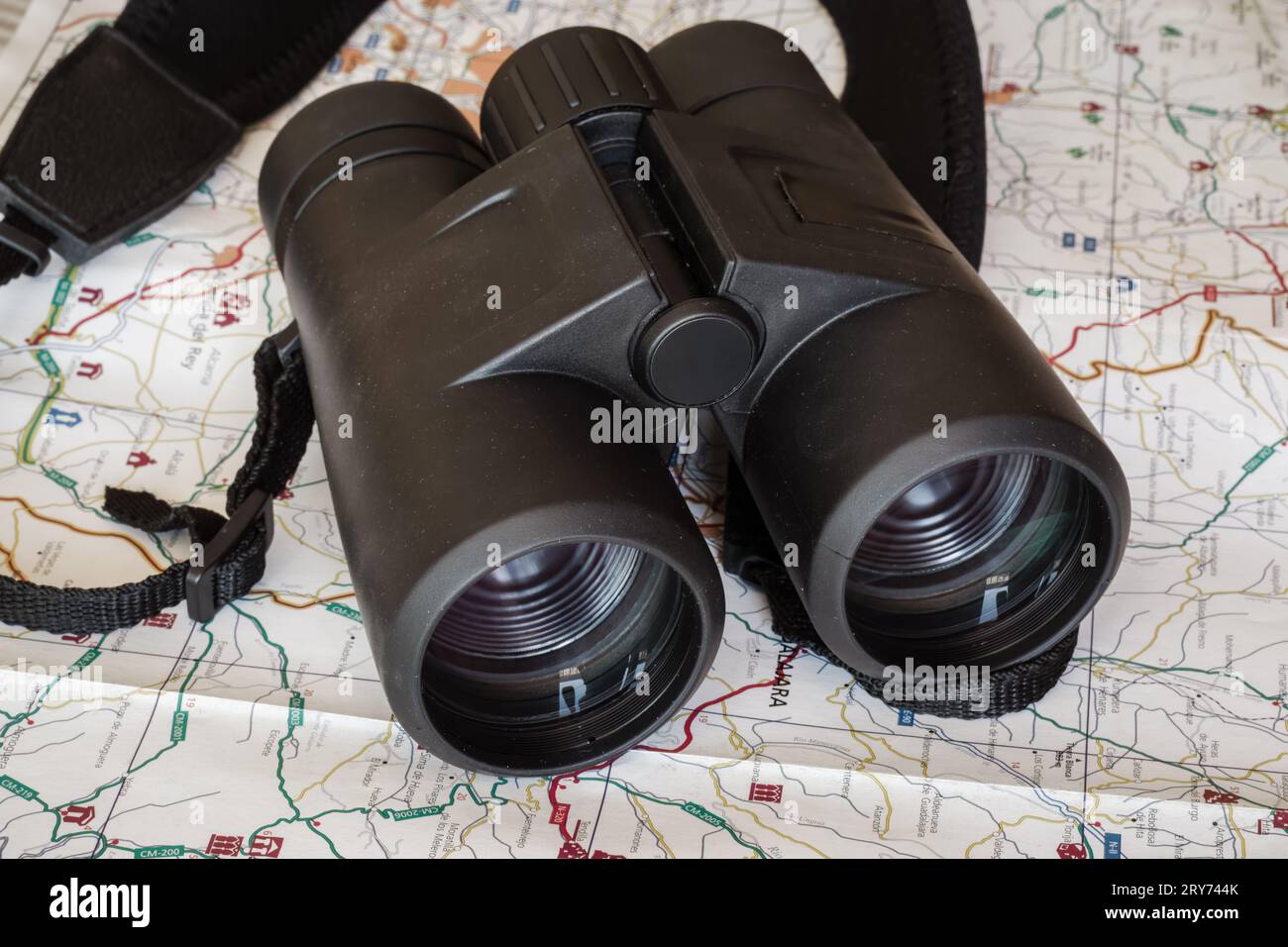 Black binoculars on a spanish map Stock Photo Alamy