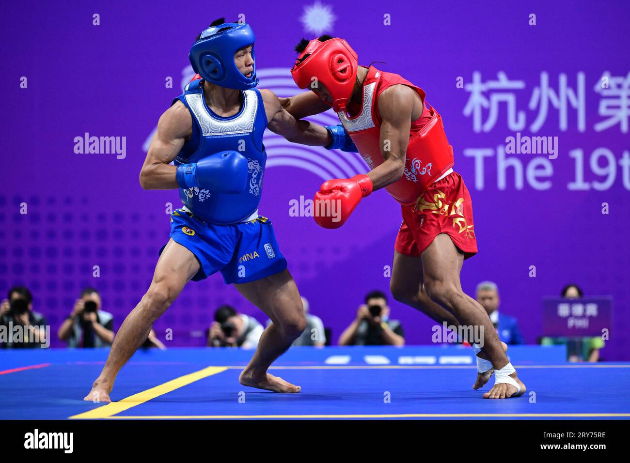 Hangzhou, China. 29th Sep, 2023. Arnel Mandal (R) of the Philippines and Jiang Haidong (L) of China compete during the Asian Games 2023, Wushu Sanda Men's 56Kg Final match at Xiaoshan Guali Sports Centre. Jiang won the match by point difference. (Photo by Luis Veniegra/SOPA Images/Sipa USA) Credit: Sipa USA/Alamy Live News Stock Photo