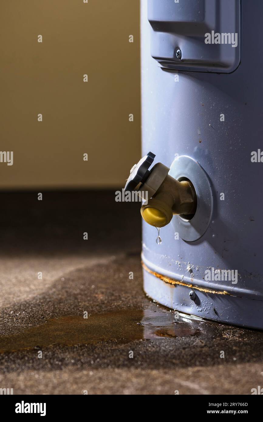 Water leaking from the plastic faucet on a residential electric water