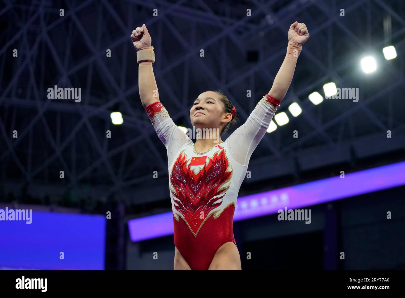 China's Xijing Tang celebrates after competing in the Artistic ...