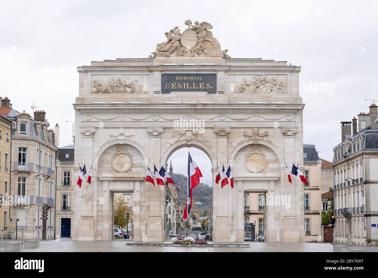 War memorial gate Désilles with tricolor flags Stock Photo