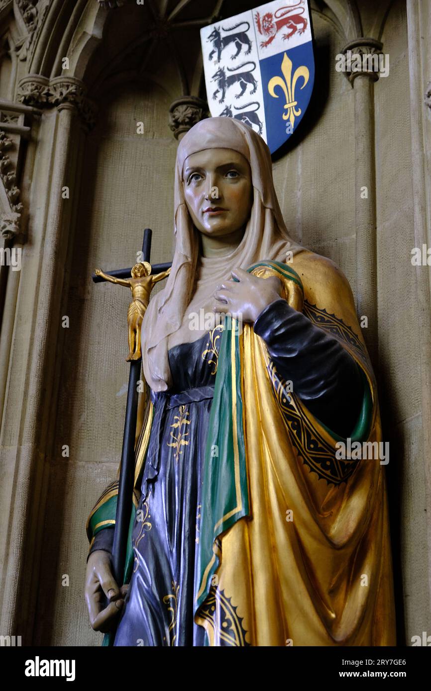 Painted church statues of Saints with armorial Stock Photo Alamy