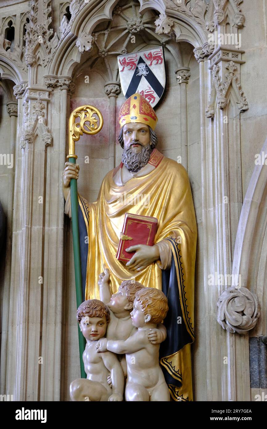 Painted church statues of Saints with armorial Stock Photo Alamy