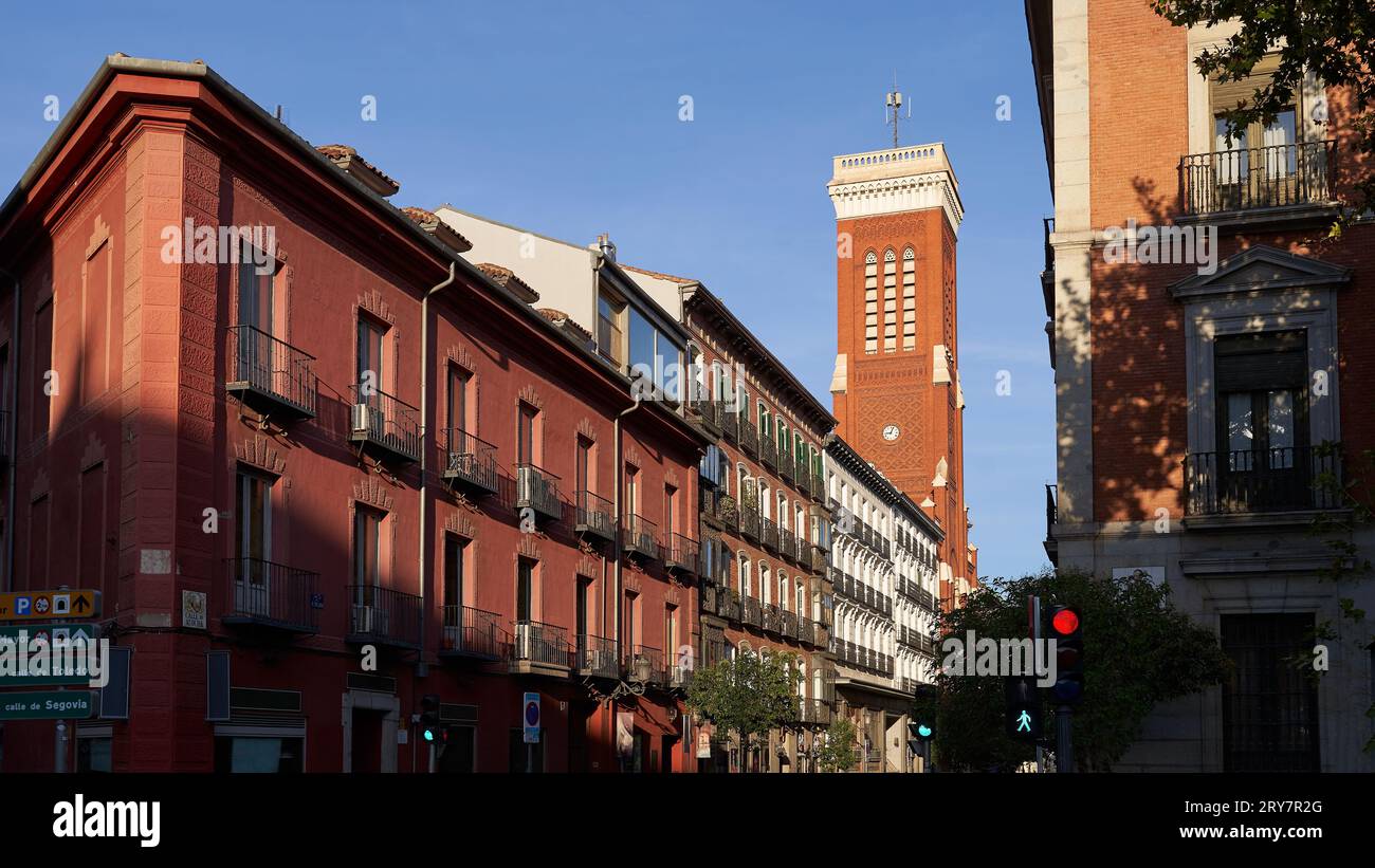 Madrid, Spain. Beautiful Calle de Atocha street with bell tower of thee Church of Santa Cruz Stock Photo