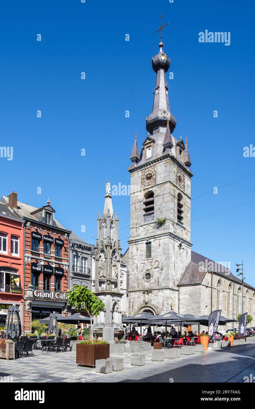 Saint Peter and St Paul Collegiate Church and Princes' fountain at Grand Place in the city Chimay, province of Hainaut, Ardennes, Wallonia, Belgium Stock Photo
