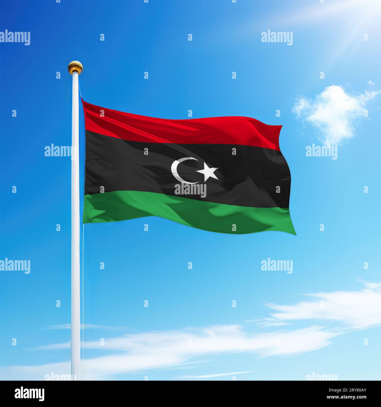 Waving flag of Libya on flagpole with sky background. Template for ...