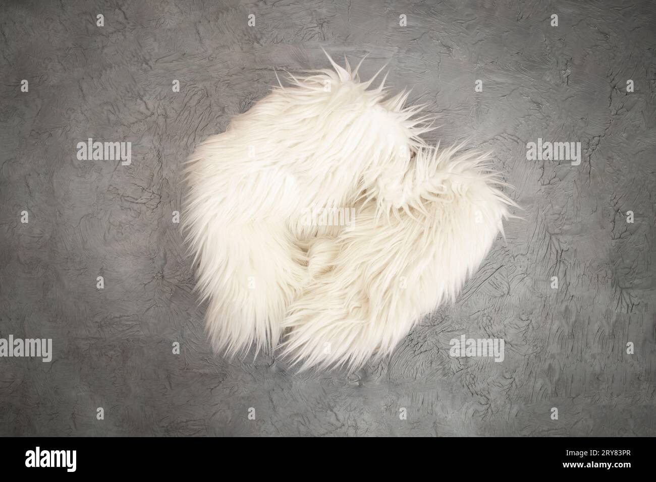 New born or baby portrait photography backdrop white fur,  cement texture, flat lay Stock Photo
