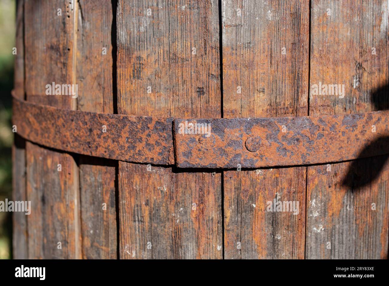 Obsolete wooden barrel with rust pattern, soft focus close up Stock Photo