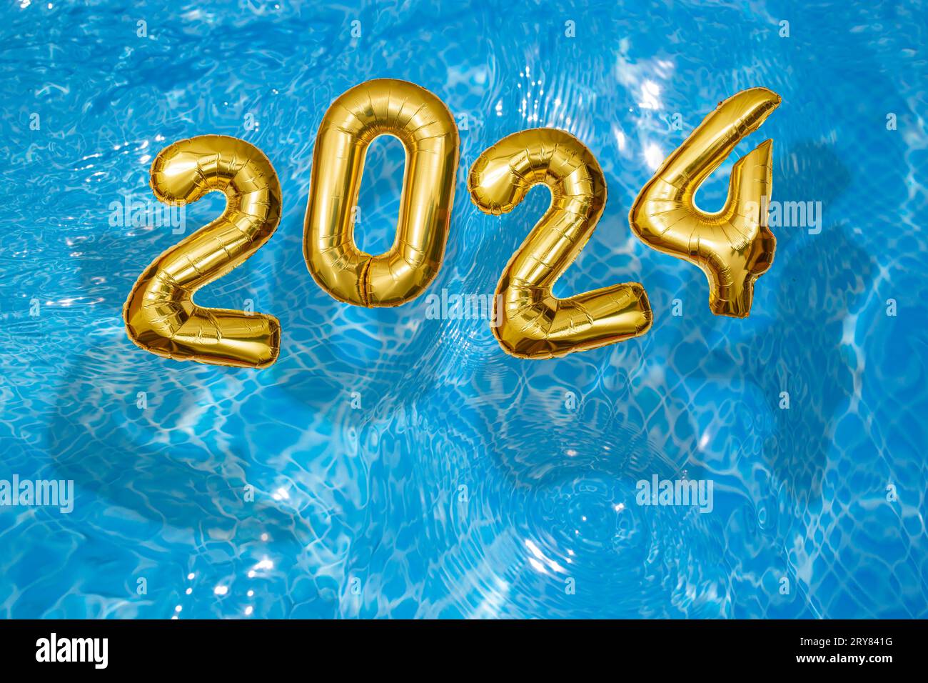 2024 Inflatable golden numbers on water ripples surface, happy new year
