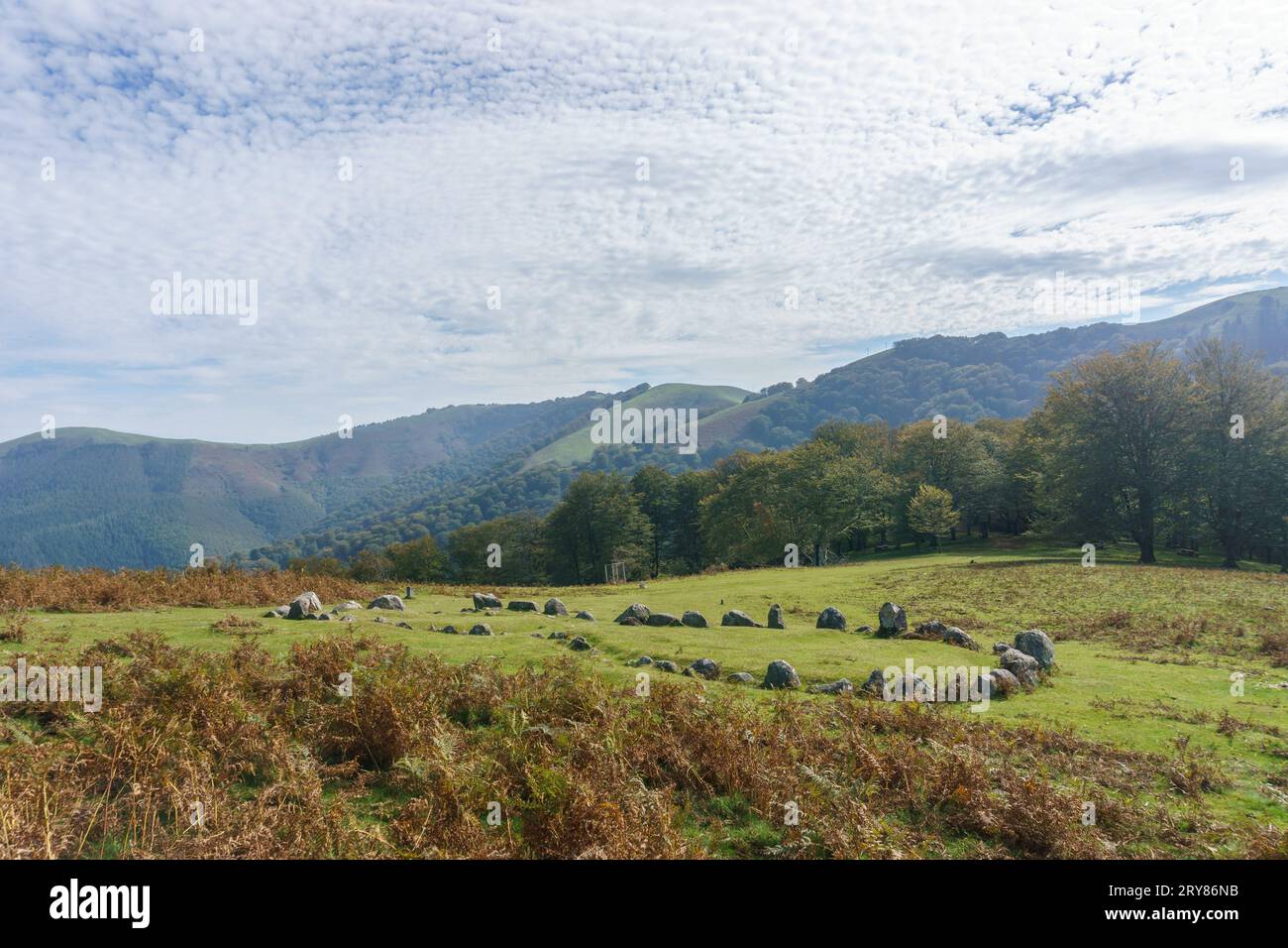 Stone circle Cromlech of Oianleku Harrespila with beautiful mountain landscape in autumn, Aiako Harria, Basque Country, Spain Stock Photo