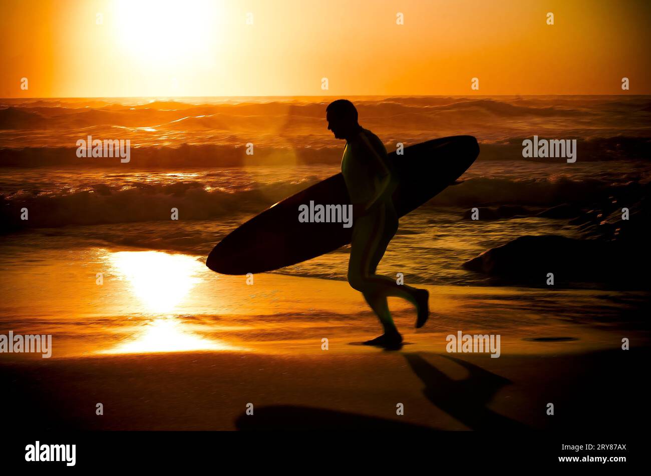 Silhouette surfer running sea hi-res stock photography and images - Alamy