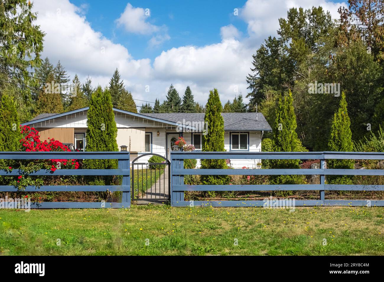 North American Farm country house in the field with fence. Countryside ...