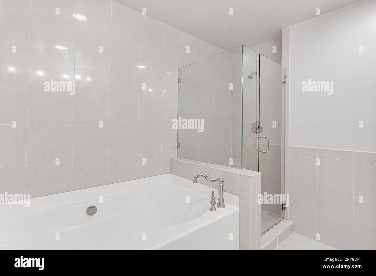 View of New Modern Bathroom Apartment Interior with White Soaking Tub and Glass ...