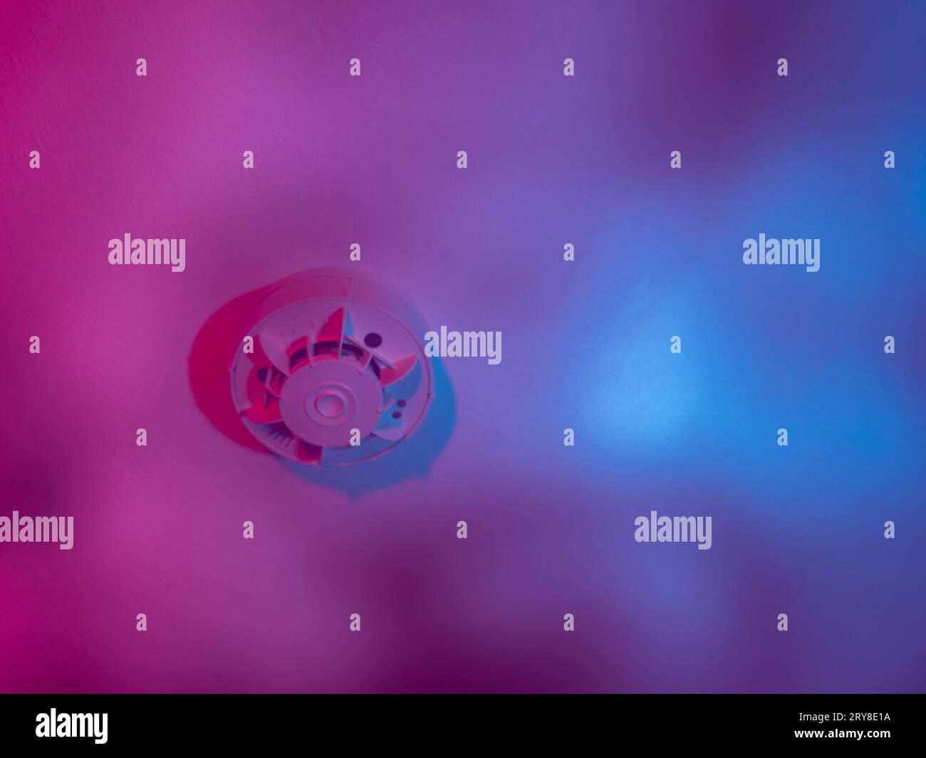 The smoke detector is installed on the ceiling, underneath it rises