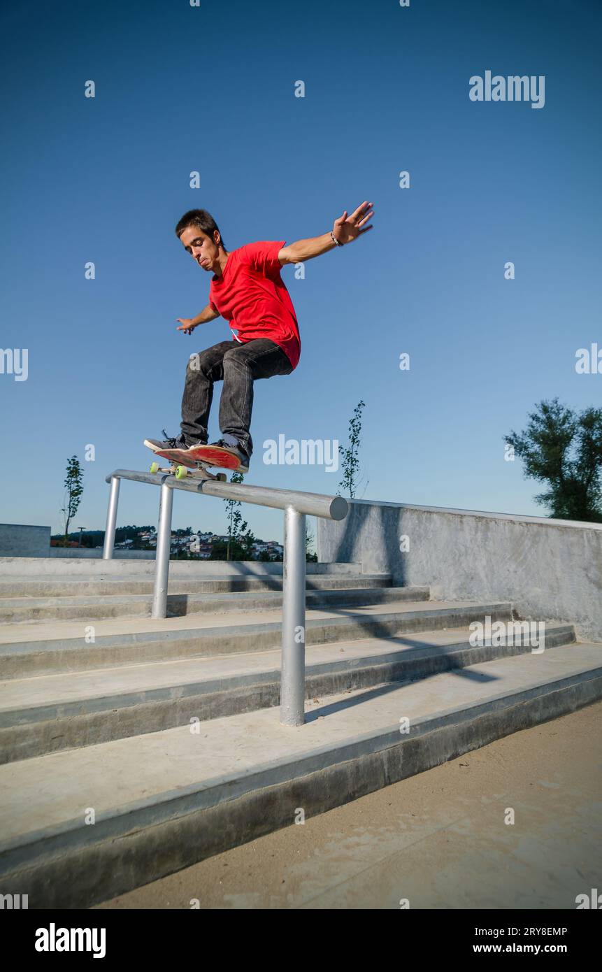 Skateboarder on a grind Stock Photo