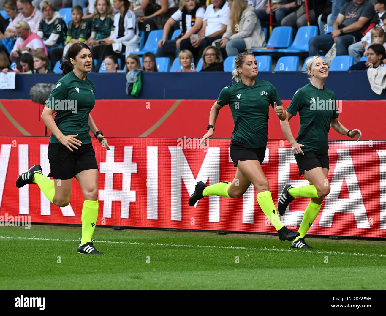 BOCHUM - Referee Alina Pesu (m) with her assistants Petruta Iugulescu and Daniela Constantinescu during the UEFA Nations League women's match between Germany and Iceland at the Vonovia Ruhr Stadium on September 26, 2023 in Bochum, Germany. ANP | Hollandse Hoogte | GERRIT VAN COLOGNE Stock Photo