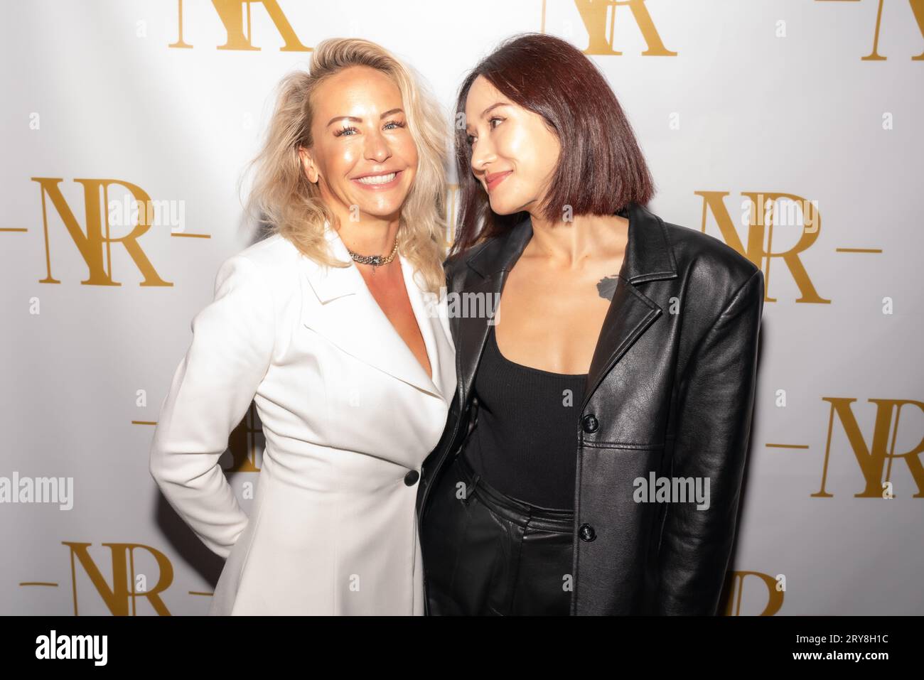 Julie Hines and guest attends Speakeasy Restaurant The Newsroom grand opening hosted by Jax