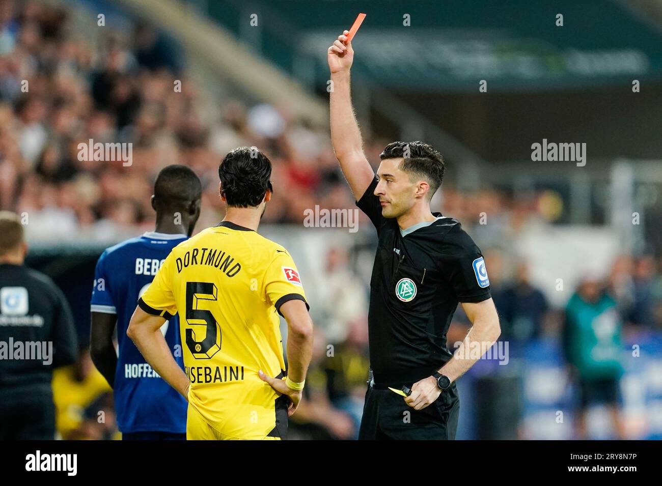 Borussia Dortmund's Ramy Bensebaini Hospitalized After Red Card in Supercup Clash Against Bayern Munich Borussia Dortmund's Ramy Bensebaini Hospitalized After Red Card in Supercup Clash Against Bayern Munich