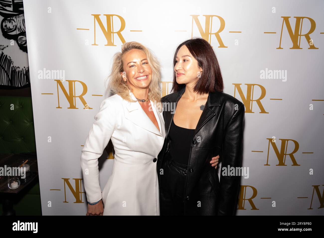 Julie Hines and guest attends Speakeasy Restaurant The Newsroom grand opening hosted by Jax