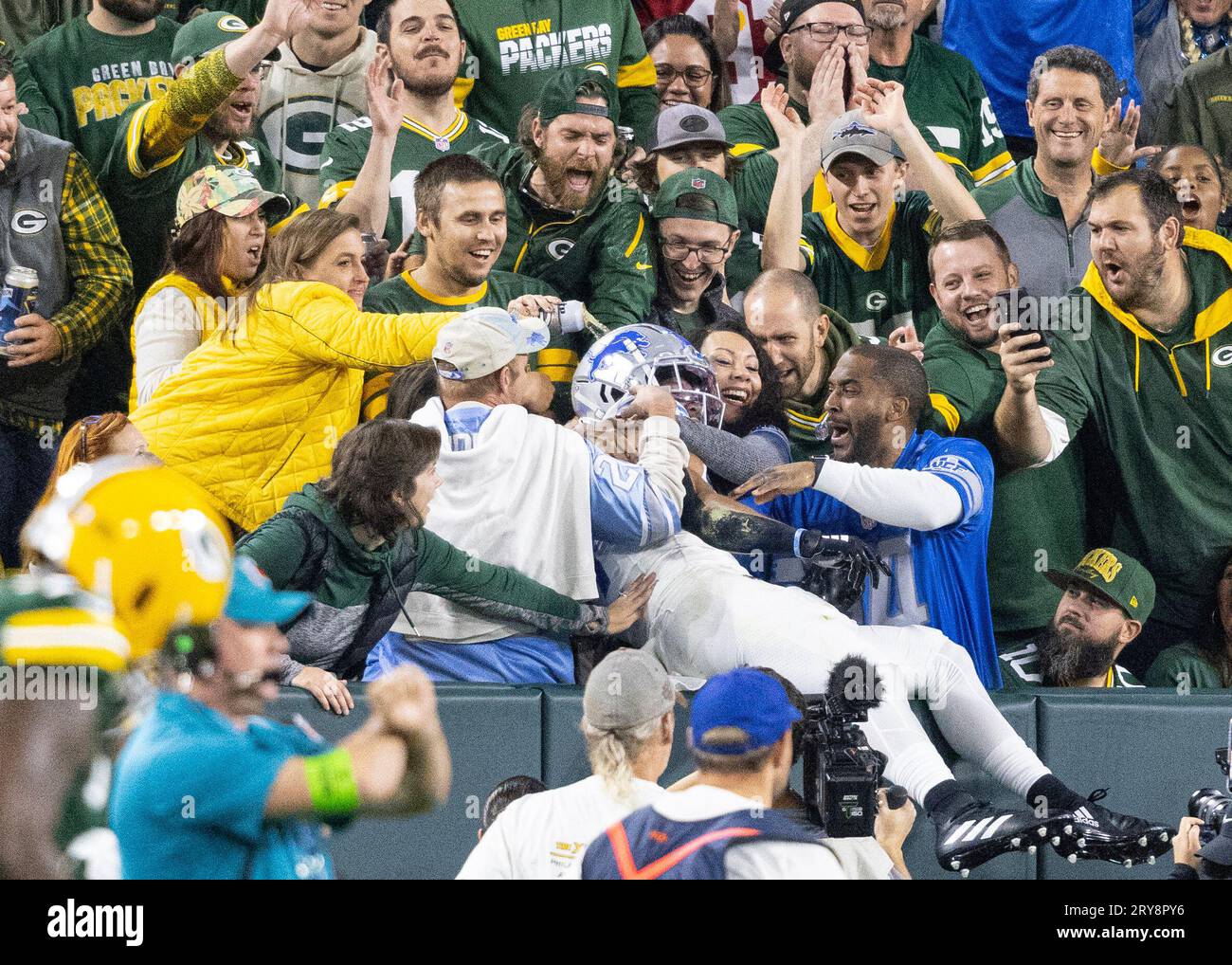 A Packers fan poured beer on Detroit Lions WR Amon-Ra St. Brown