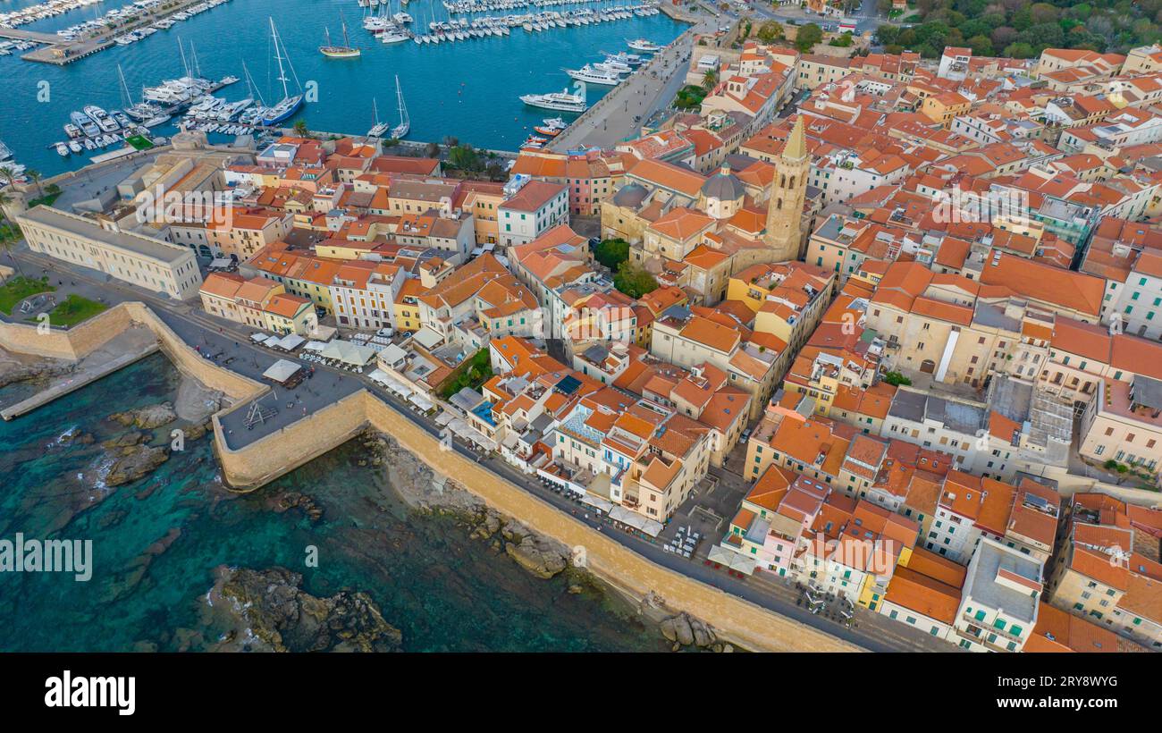 Aerial view of the old town of Alghero in Sardinia. Photo taken with a drone on a sunny day. Panoramic view of the old town and harbor of Alghero, Sar Stock Photo