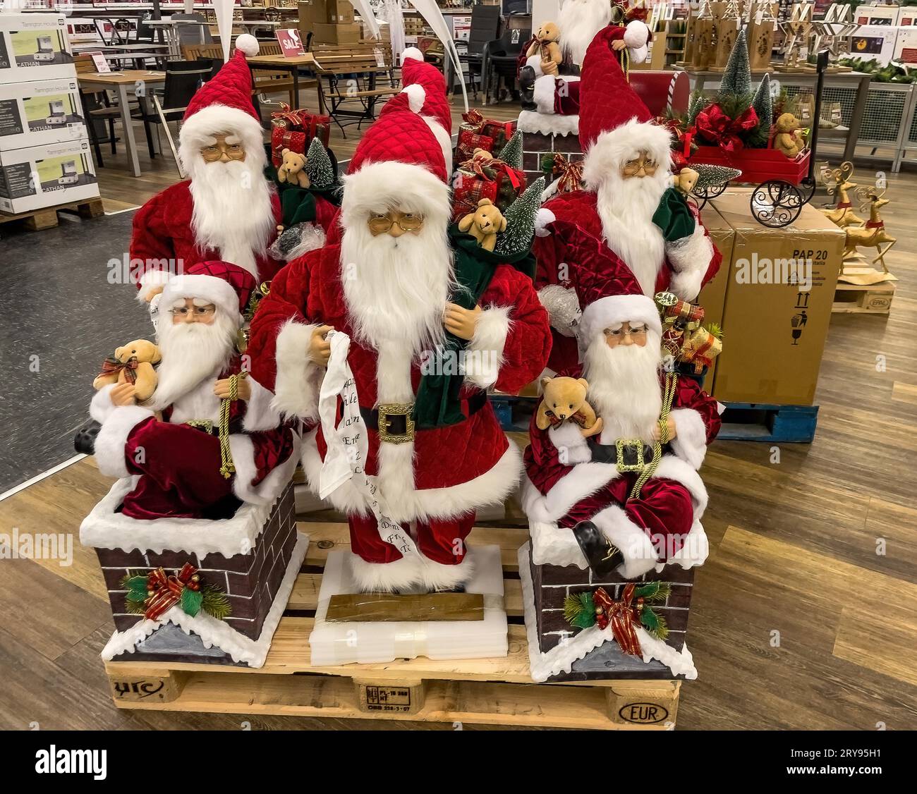 Sales offer of wholesale in early autumn of Christmas decoration decoration for Christmas with different sized Santas, Germany Stock Photo