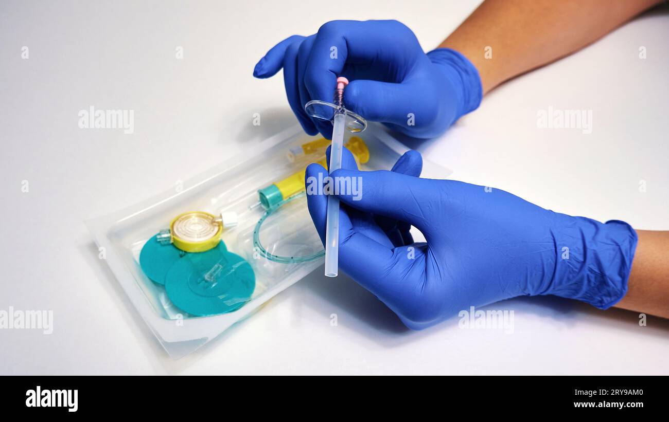 A needle for epidural anesthesia is in the hands of a physician. Modern