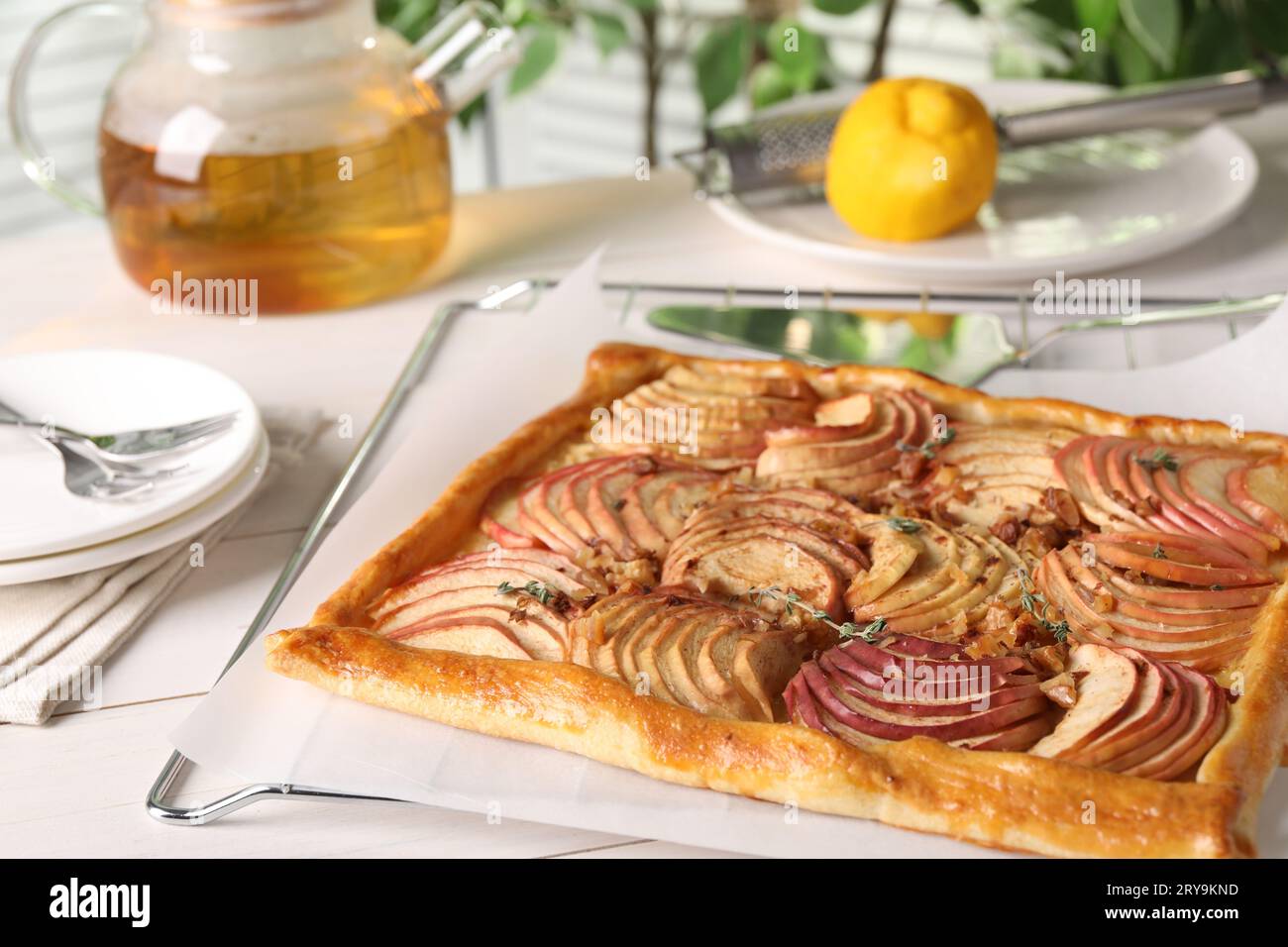 Freshly baked apple pie served on white wooden table Stock Photo