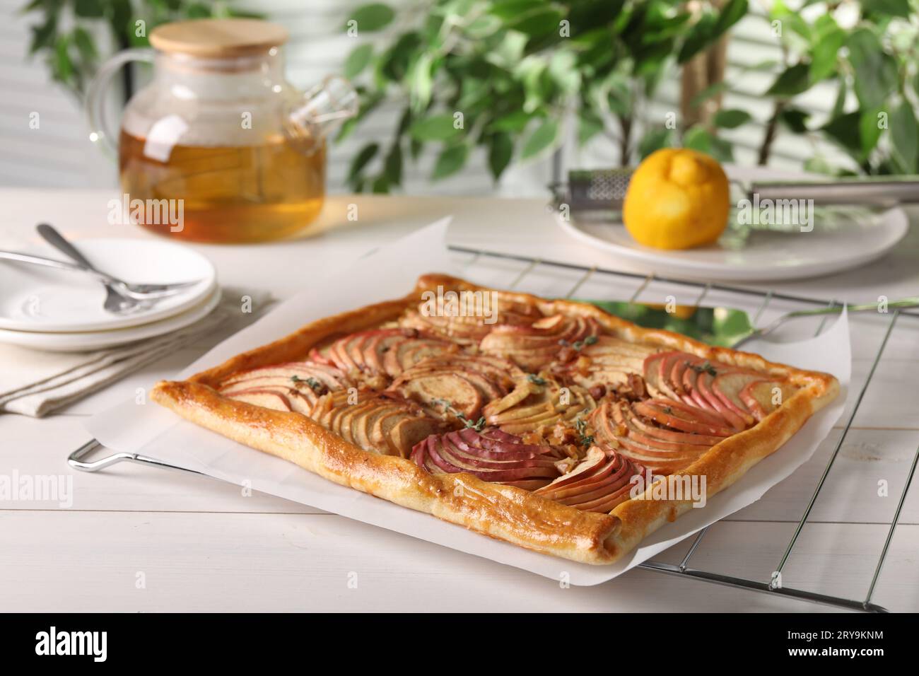 Freshly baked apple pie on white wooden table Stock Photo