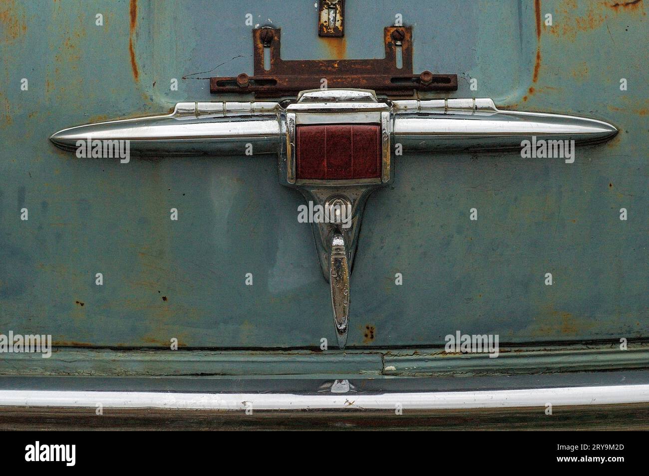 chrome handle of trunk lid on old car Stock Photo