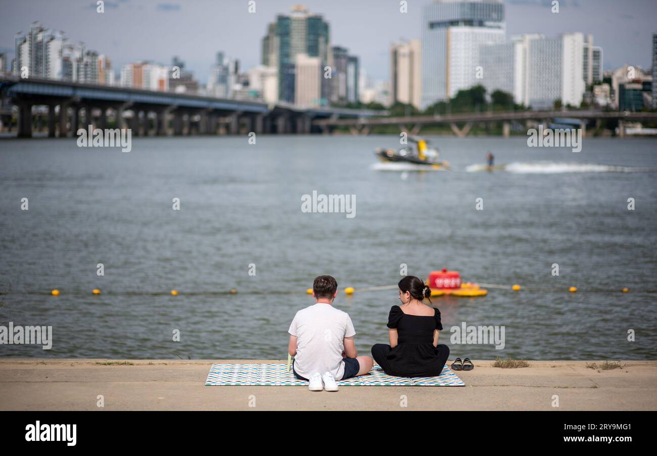People picnicing in Yeouido park on Han river in Seoul, South Korea on 23 September 2023 Stock Photo