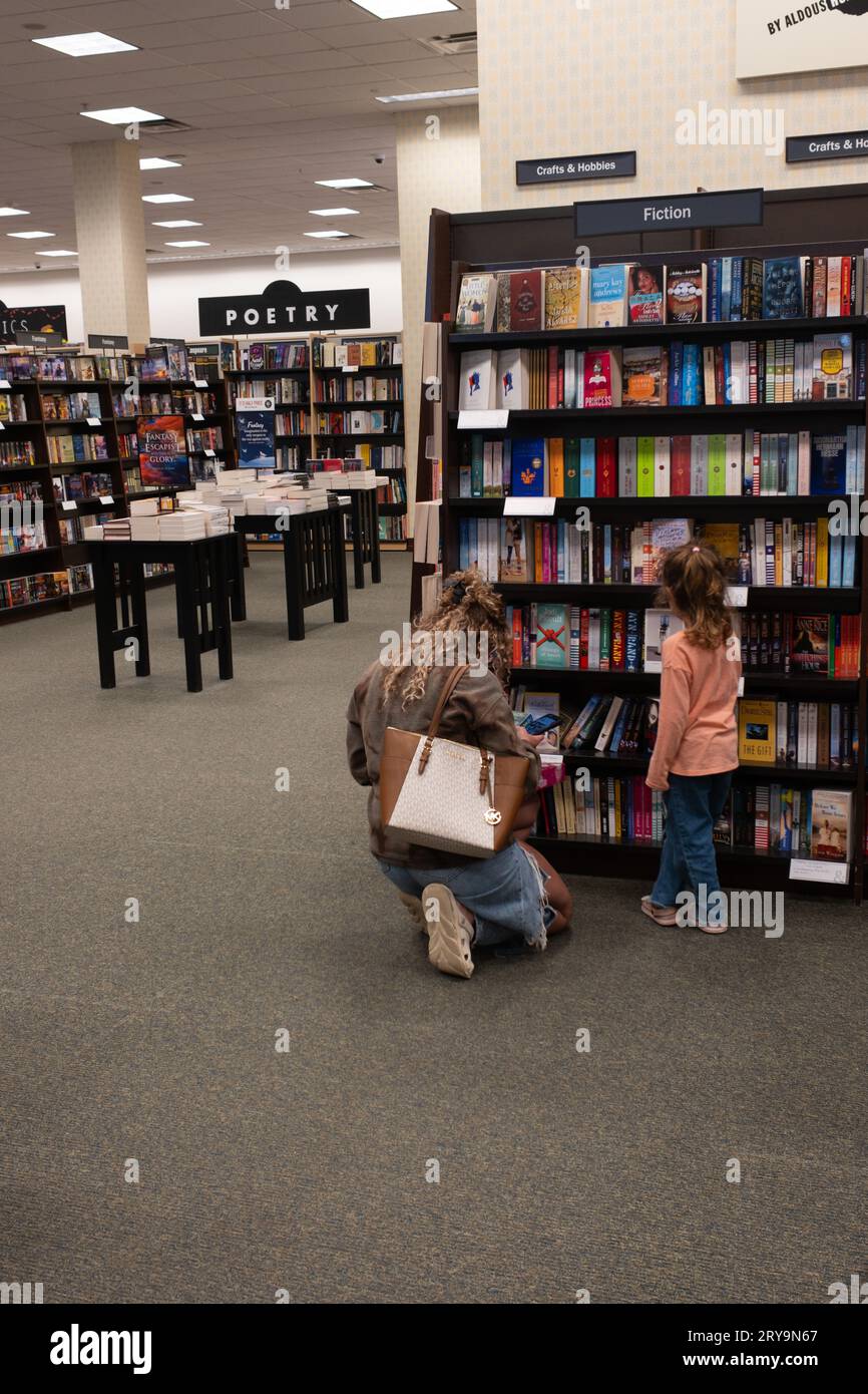 A woman and child shopping at a Barnes and Noble bookstore Stock Photo
