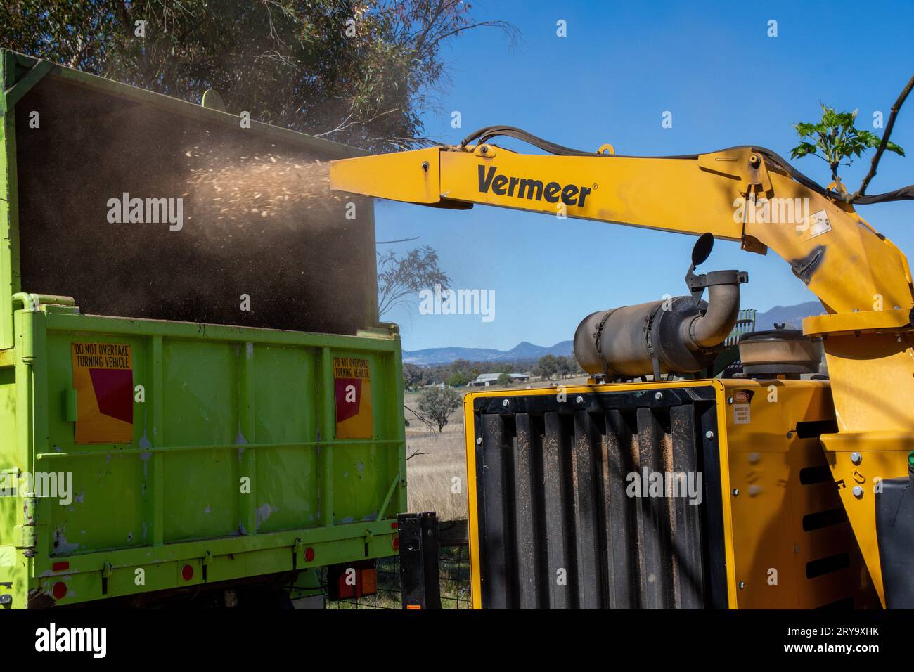 A Vermeer BC1800XL Diesel powered Wood Chipper or mulcher at work on an