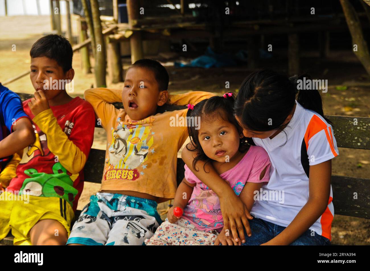 Amazonian Kids Enjoying Lollipops & Candies, Amazon Village, Peru Stock Photo