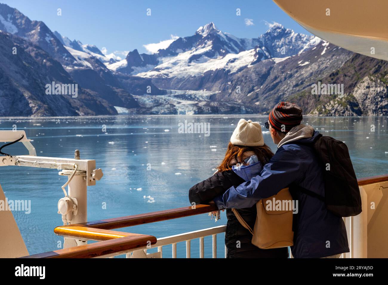 Couple on cruise ship admiring the Johns Hopkins Glacier in Glacier Bay National Park and Preserve, near Juneau, Alaska, USA Stock Photo