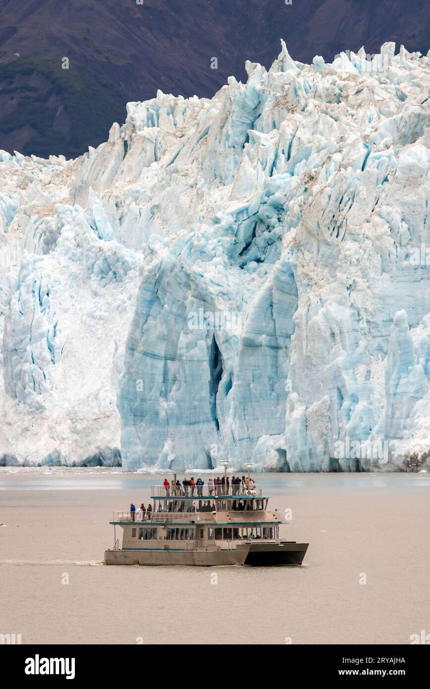 Tourist excursion vessel (St. Theodosius) near the Hubbard Glacier in Disenchantment Bay, Alaska, USA Stock Photo