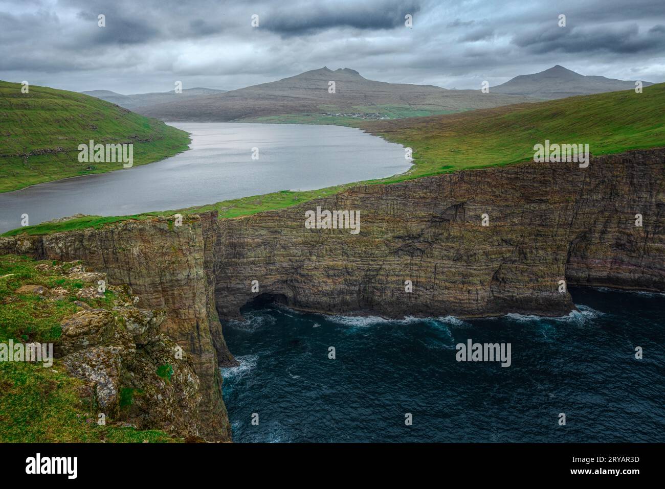 Overhanging lake Sorvagsvatn from the Traelanipa cliffs in Vagar, Faroe Islands Stock Photo