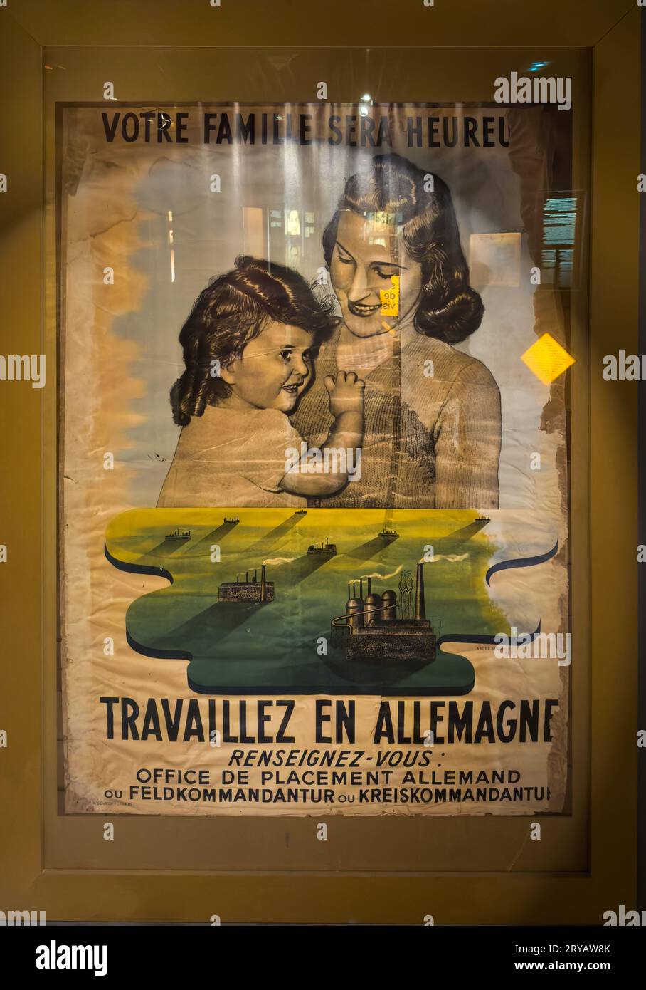 A WW2 German Nazi propaganda poster in the Resistance and Deportation Museum in Grenoble, France,  appealing for people to go and work in factories in Stock Photo