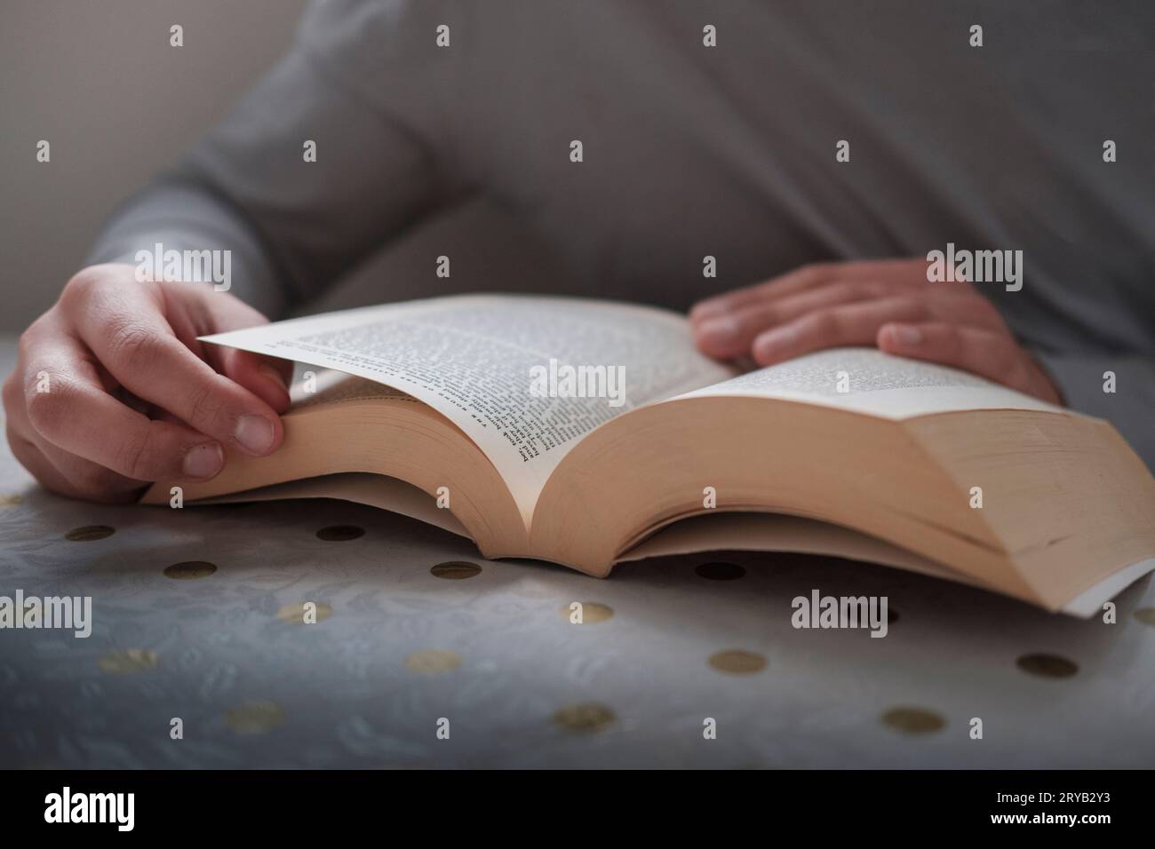 Woman reading a book-close-up Stock Photo