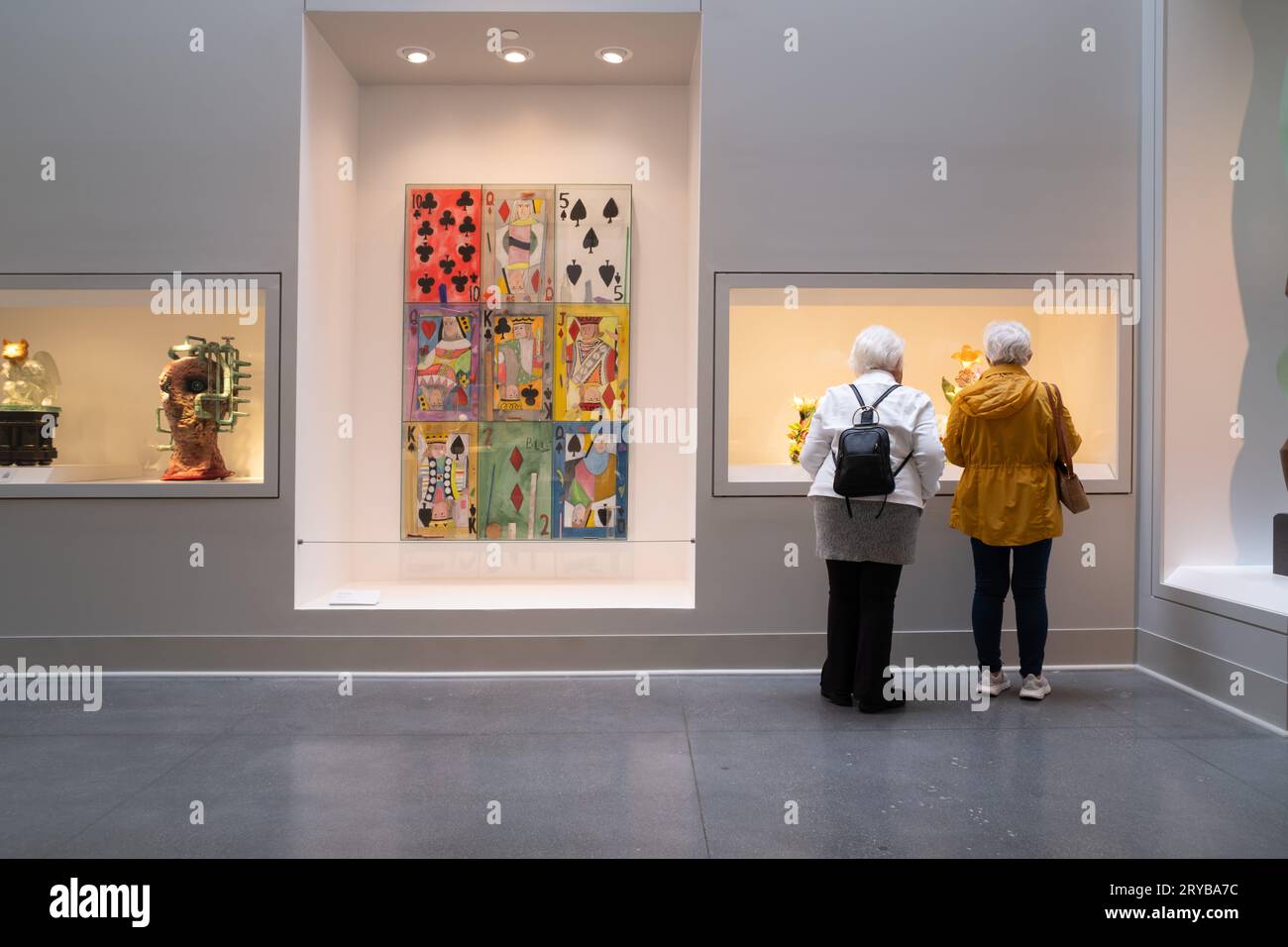 Two women looking at a contemporary glass art exhibit at the Flint Institute of Arts Stock Photo