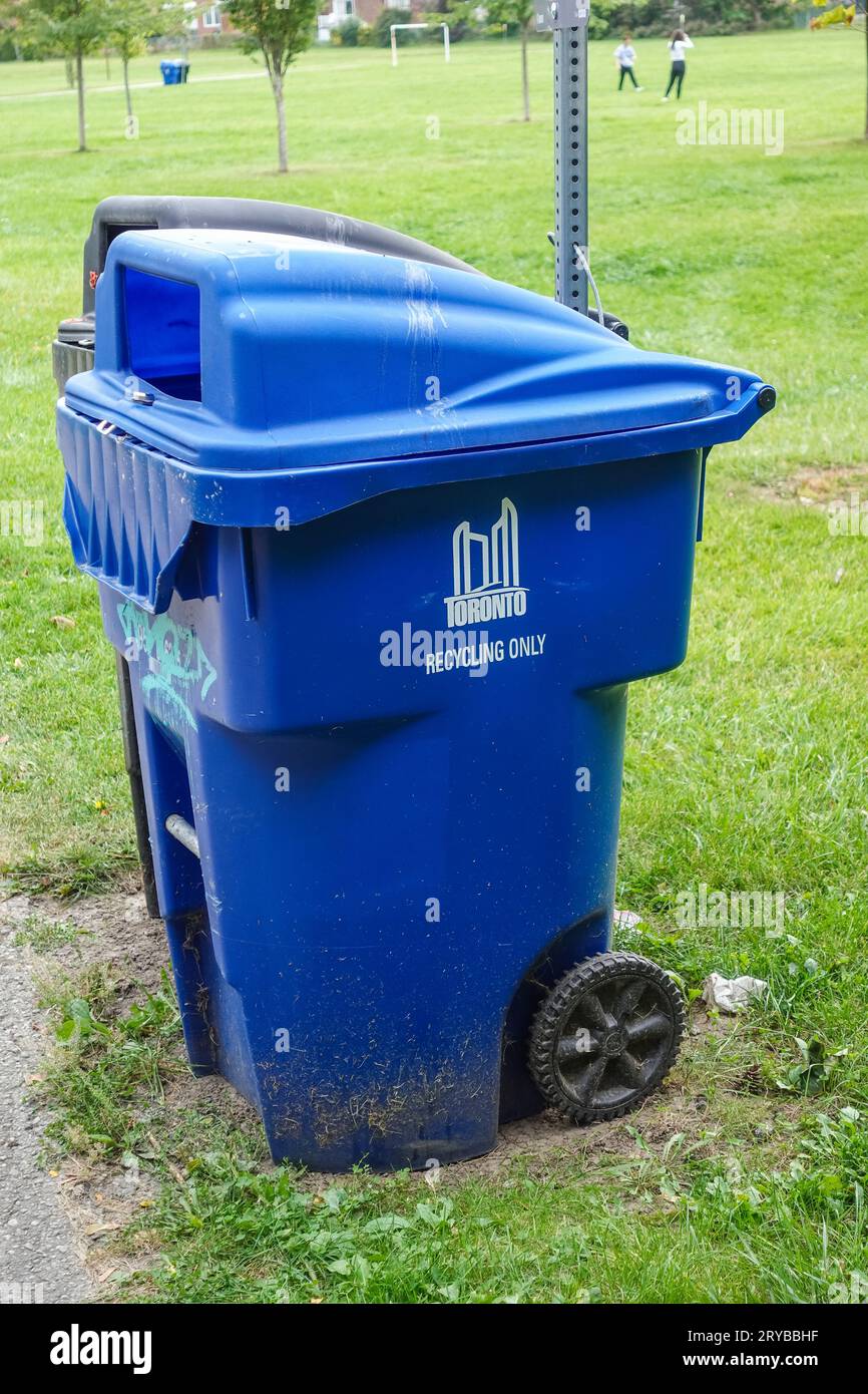 toronto blue recycling bin outside at a park Stock Photo Alamy