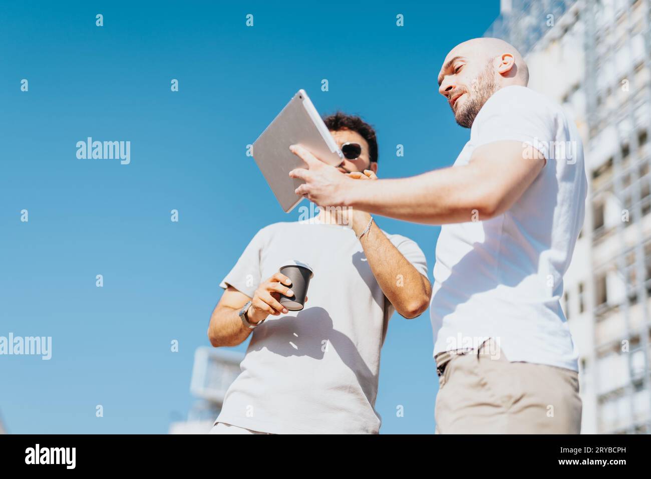 Successful Architects Collaborating on Urban Construction Project Stock Photo