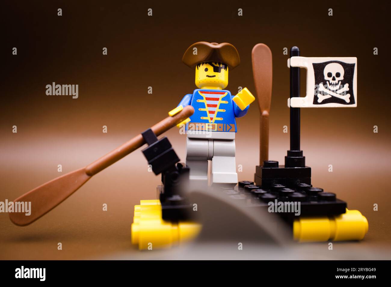 A pirate alone on the sea. Sharks are already there Stock Photo