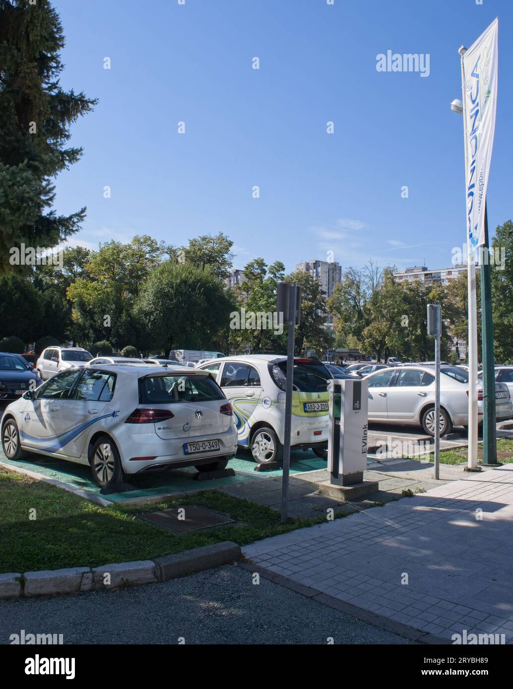 Sarajevo, Bosnia and Herzegovina - Sep 27, 2023: A static shot of electric car charging at the EPBIH AC charging station in a sunny summer day. Select Stock Photo