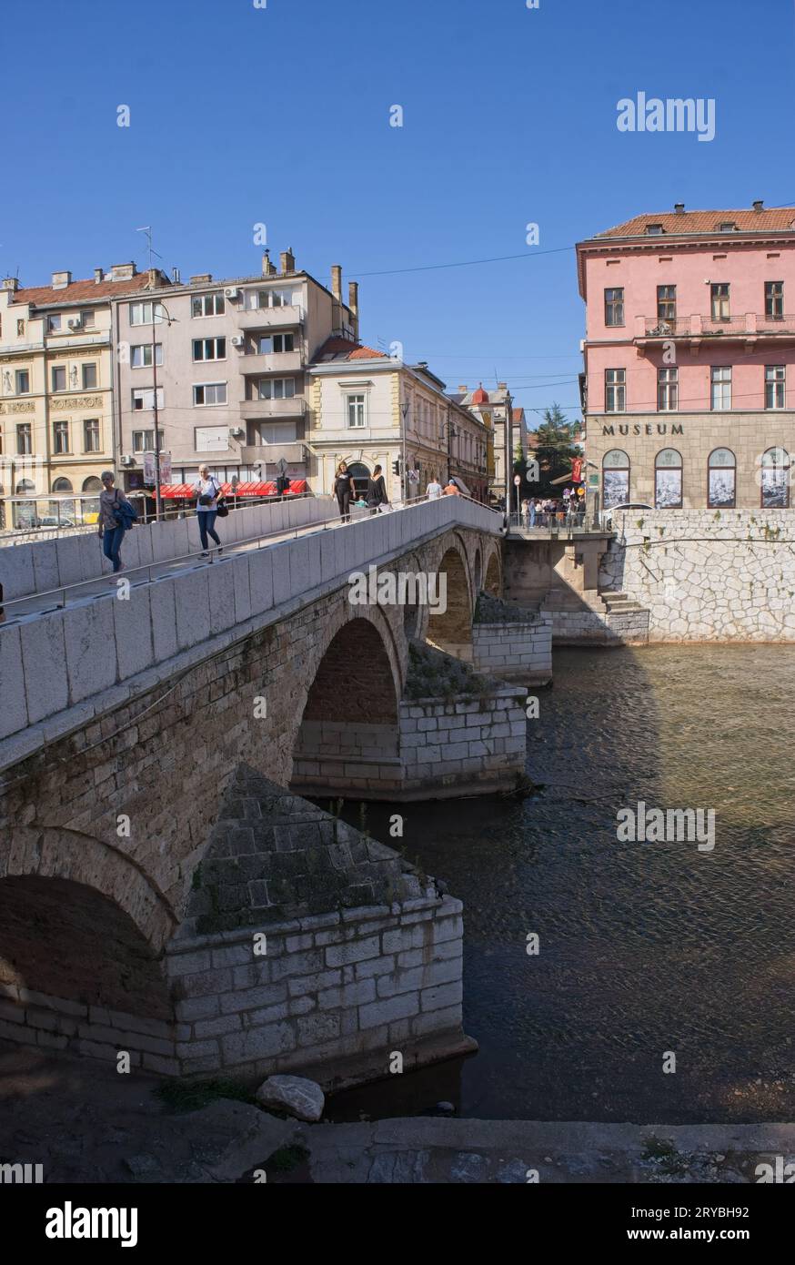 Sarajevo, Bosnia and Herzegovina - Sep 27, 2023: Ottoman-era stone bridge near the site of the assassination of Archduke Franz Ferdinand in 1914. Car Stock Photo